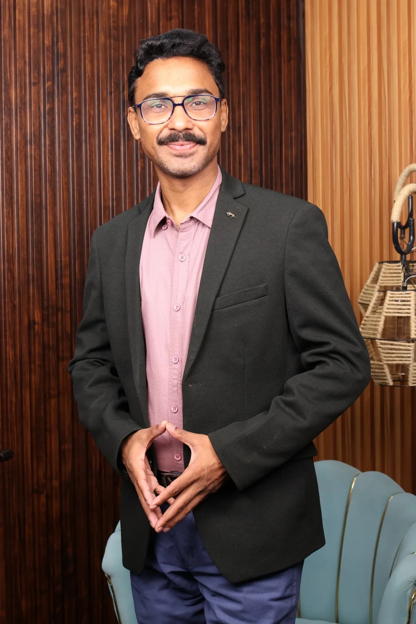 Adarshh Panndey standing with his hands together